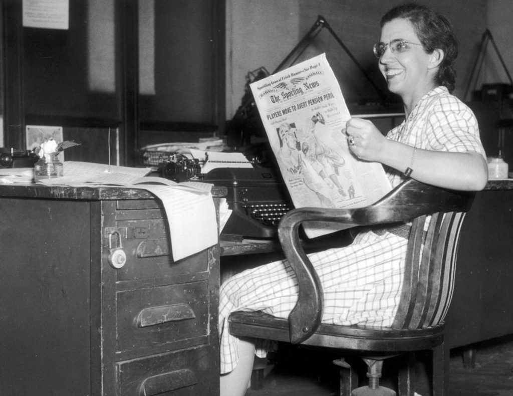 Mary Garber, sports journalist, at her desk