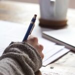 Young woman writing